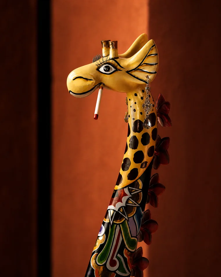 Cigarette detail on a hand-painted Tom's giraffe