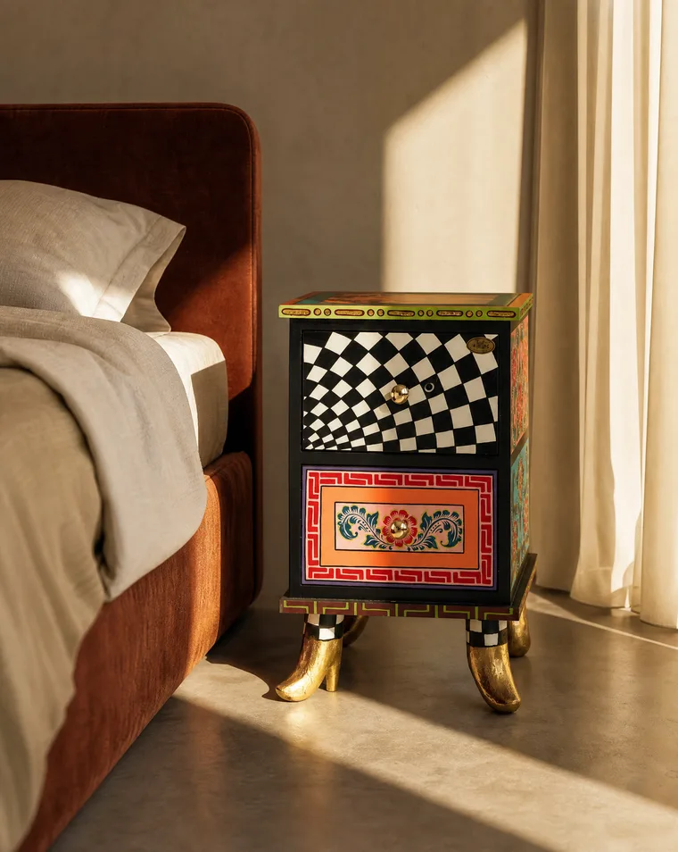 Black-and-white checkerboard pattern on a hand-painted nightstand