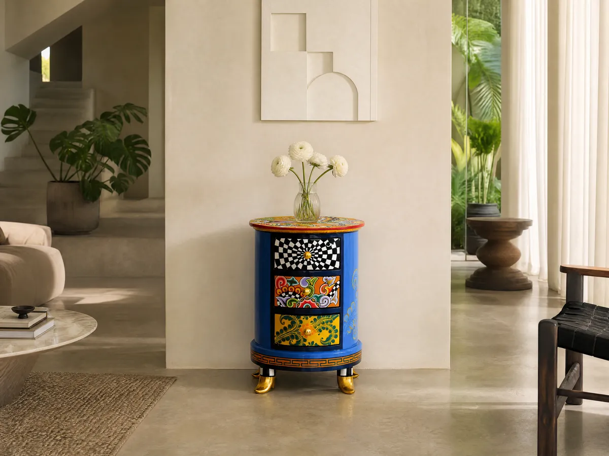 A hand-painted Tom's round nightstand in a light living room